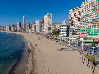 Aerial photo taken in Benidorm in Spain Alicante, showing the beautiful beach of Playa Levante and hotels, buildings, and high rise skyline cityscape.