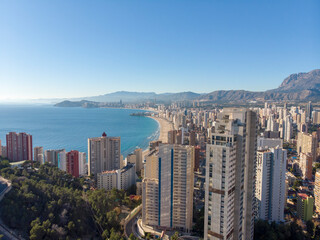 Obraz premium Aerial photo taken in Benidorm in Spain Alicante, showing the beautiful beach of Playa Levante and hotels, buildings, and high rise skyline cityscape.