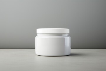 Glossy shoe polish cream jar  porcelain gray gray background.