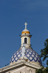 Dome of the Cathedral of San Miguel de Tucuman (Argentina) with a figure of the Virgin Mary in the foreground