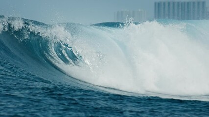Beginner surfer learns take off on big waves