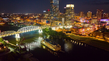 Fototapeta premium Aerial View of Nashville Night Skyline with John Seigenthaler Bridge