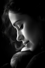 Dramatic close-up view of a mother tenderly cradling her infant their connection palpable in the chiaroscuro lighting