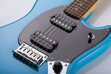 Close-up of blue electric guitar steel strings.  Close-up image. Studio shot. 