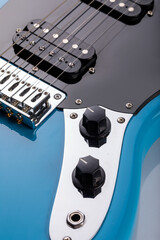 Close-up of blue electric guitar steel strings.  Close-up image. Studio shot. 