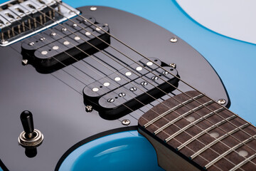 Close-up of blue electric guitar steel strings.  Close-up image. Studio shot. 