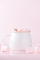 Chocolate drink with marshmallows on a pink background. Vegan, sugar and lactose free. Vertical orientation.