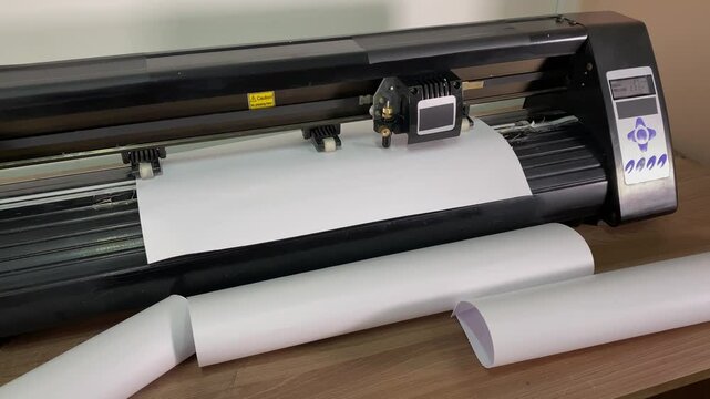 paper plotter. flatbed cutting plotter. large order. slow motion video shooting. High quality shooting in 4K format.