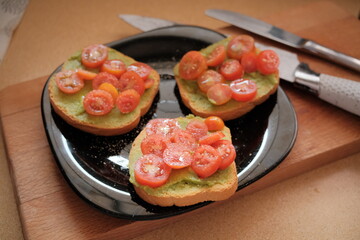 Avocado toast with cream and cherry tomatoes