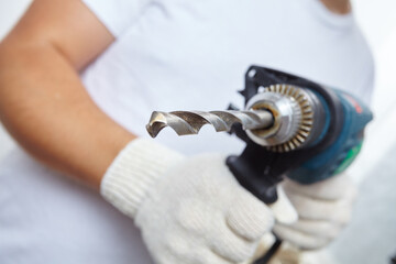 man with Electric screwdriver in hands