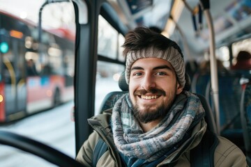 A person sits on a bus wearing a scarf around their neck, ready for travel