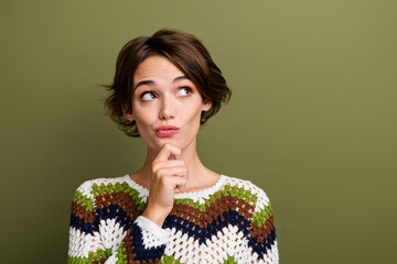 Photo portrait of pretty young girl look unsure empty space wear trendy print knitwear outfit...
