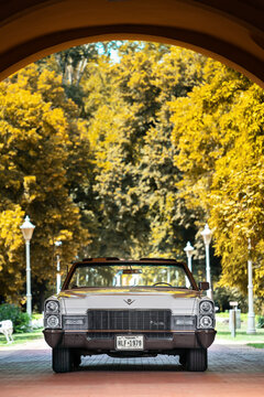 Vertical image of Cadillac De Ville Convertible (third generation 1965&ndash;1970) with stacked dual headlights. Front view. Autumn  toned. Palic, Serbia, 30.06.2024