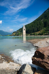 View of Lake Resia where you can admire the famous bell tower of