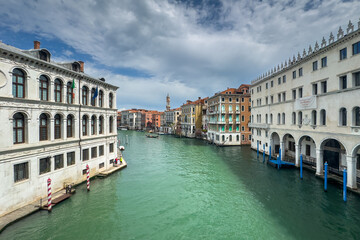 Gondola photo in Venice. Beautiful video with touristic taxi and local gondola boats cruising on the channels of Venice. Landmark landscape view of Italy.