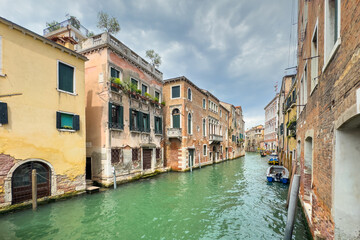 Gondola photo in Venice. Beautiful video with touristic taxi and local gondola boats cruising on the channels of Venice. Landmark landscape view of Italy.