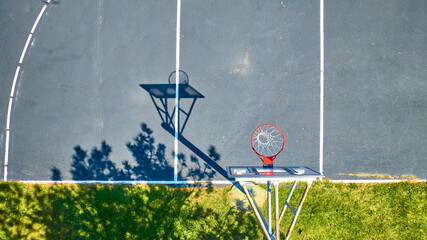 Aerial Top Down Detail of Basketball Court and Hoop Shadow at Golden Hour © Nicholas J. Klein