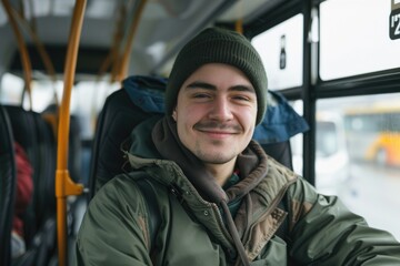 Fototapeta premium A person sitting on a public bus wearing a hat, perfect for transportation or travel scenes