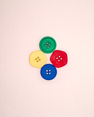 Four colored buttons on white background