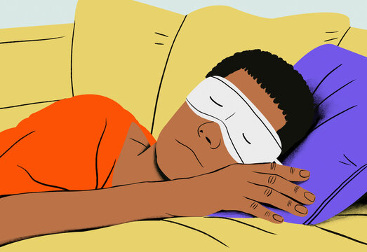 A person is peacefully sleeping with an eye mask on, resting on a purple pillow and yellow couch.