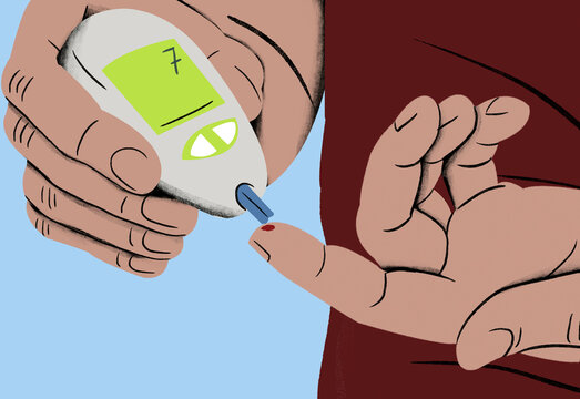 Close-up of a person using a portable glucometer to check blood sugar levels by pricking a finger.