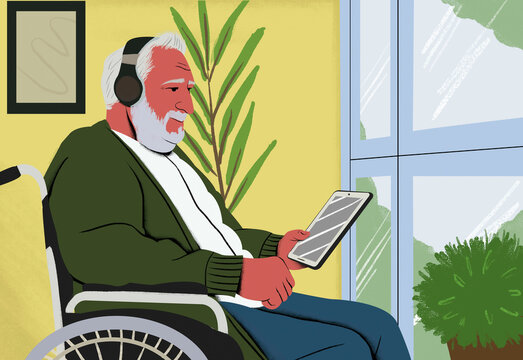Elderly man with white hair and beard using a tablet in a wheelchair by the window, with plants and a picture frame in the background.