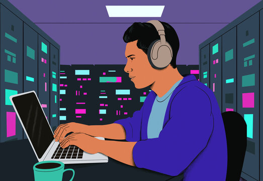 Side profile of a focused man wearing headphones while working on a laptop in a colorful office setting at night.