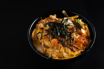 Katsudon with rice japanese food isolate in black background