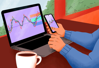 Close-up of a person's hands analyzing financial graphs on a laptop and mobile phone with a coffee cup on the table.