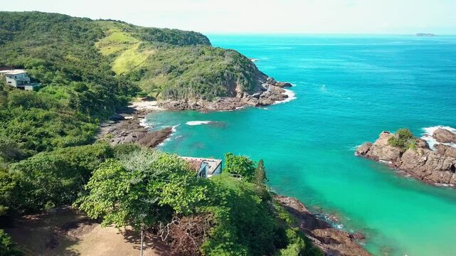 Stunning aerial footage of Praia dos Amores in B&uacute;zios, with crystal clear waters and surrounding greenery