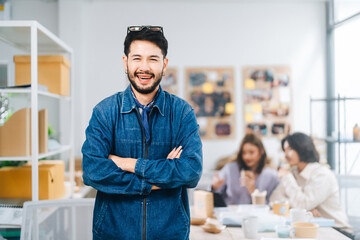 Portrait of adult southeast creative asian man wearing denim jacket standing in office gen y...