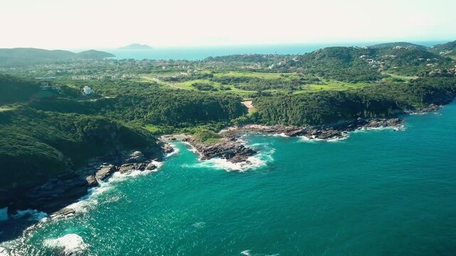 Breathtaking panorama of Praia da Foca beach in B&uacute;zios with lush green surroundings and blue sea