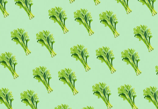 Seamless pattern of fresh green lettuce on a light green background.