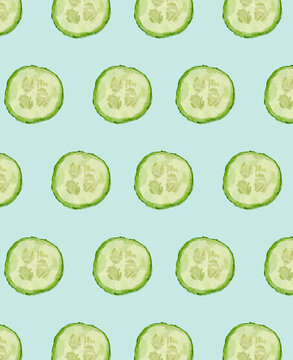 Green cucumber slices pattern on a light blue background.