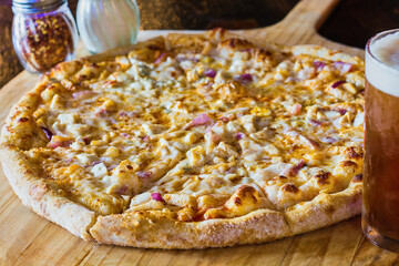 Cheese pizza with buffalo chicken breast, celery, and blue cheese