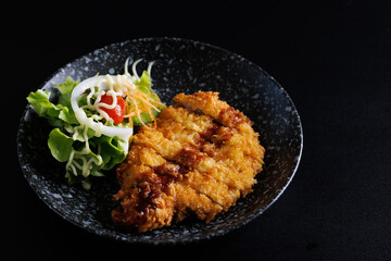 Tonkatsu Traditional Japanese food, Deep Fried Pork Cutlet isolate in black background
