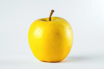 Fresh yellow apple with water droplets on its surface