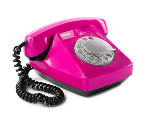 Old magenta color telephone with rotary dial isolated on white