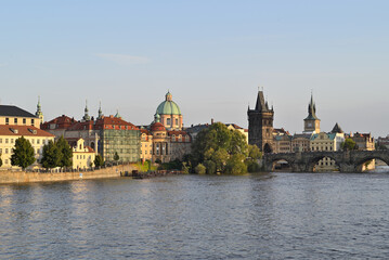 Naklejka premium Iconic Charles Bridge over Vltava river and Prague Old town cityscape at sunset, in Prague, Czech Republic