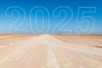 "2025" text in the sky over a desert track, representing a new year, future planning, challenges, and business ambitions, with copy space for personalization