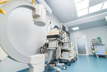 Sterile hospital room with medical gear. A variety of medical devices are arranged in a clean hospital room, showcasing advanced technology for patient care and treatment.