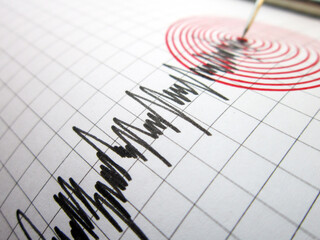 Seismograph and earthquake. A seismograph that records the seismic activity of an earthquake.