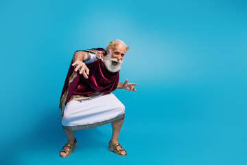 Photo of positive glad nice man wear antique clothes traditional dance isolated on blue color background