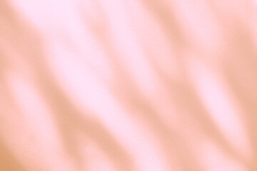 Fototapeta premium Light and shadow pink beige pastel abstract background. Natural leaves shadows and sunshine diagonal refraction on white wall texture. Shadow overlay effect foliage mockup, banner graphic layout