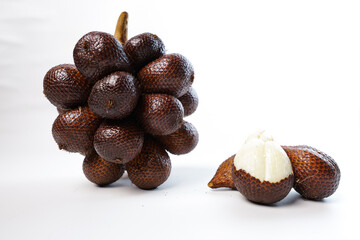 fruit salak. One stalk of snakefruit has salak, which has been peeled on a plain white background