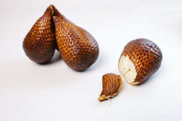 fruit salak. Snakefruit from Indonesia tastes sweet and sour with a plain white background © Amjianto