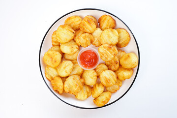 potato balls. Snacks made from fried potatoes and flour accompanied by spicy sauce on a white plate with a white background