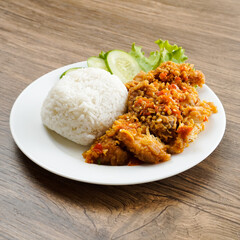 A plate of food with rice and meat on it