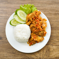 A plate of food with rice and meat on it