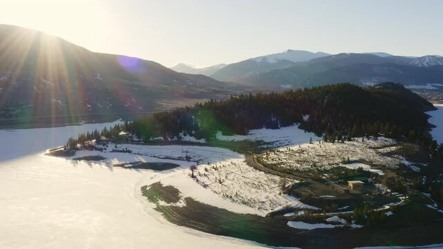 Sunrise Sun Flare Aerial Snowy Mountains